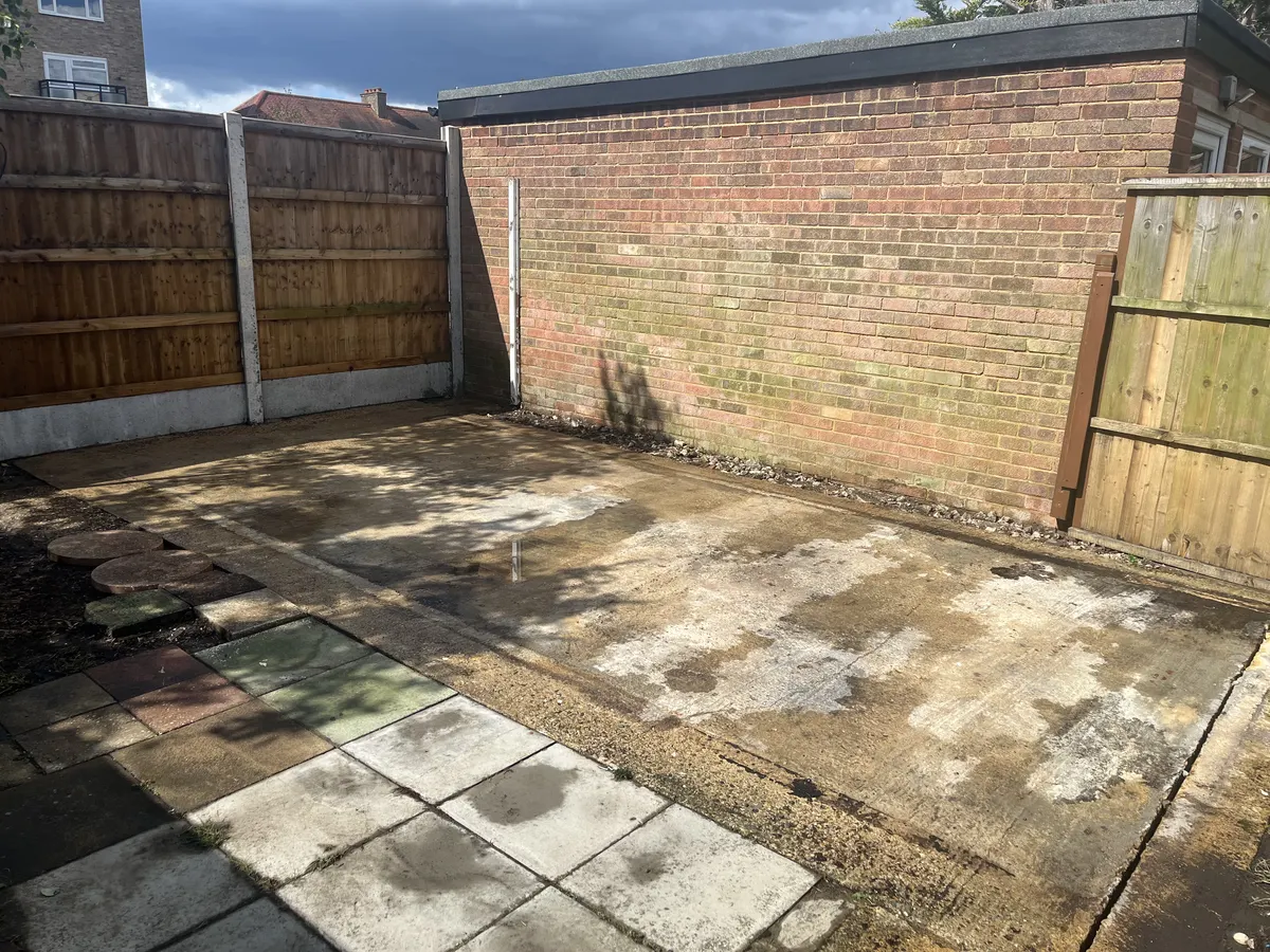 The bare concrete garage slab after the garage was demolished and cleared away